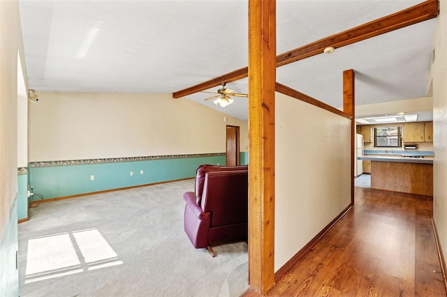 3029 Harrow Rd, Spring Hill, FL 34606 - interior space featuring baseboards, ceiling fan, lofted ceiling with beams, and wood finished floors