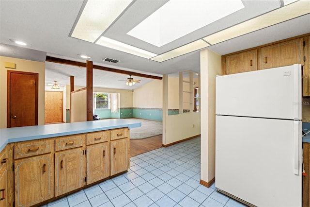 3029 Harrow Rd, Spring Hill, FL 34606 - kitchen with visible vents, freestanding refrigerator, light countertops, a ceiling fan, and light tile patterned floors
