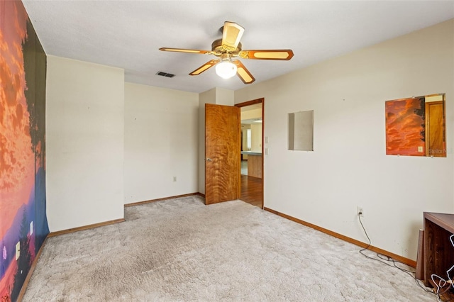3029 Harrow Rd, Spring Hill, FL 34606 - carpeted spare room featuring visible vents, baseboards, and ceiling fan