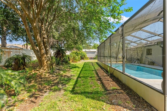 3029 Harrow Rd, Spring Hill, FL 34606 - view of swimming pool featuring a yard, fence, glass enclosure, and a fenced in pool