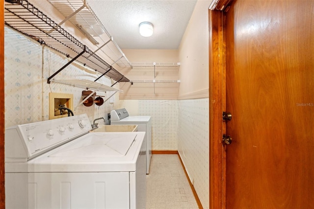 3029 Harrow Rd, Spring Hill, FL 34606 - laundry room with laundry area, baseboards, light floors, wallpapered walls, and washer and dryer
