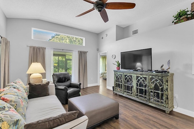 14105 Agua Clara Dr, Hudson, FL 34667 - living room featuring high vaulted ceiling, ceiling fan, wood finished floors, and a textured ceiling