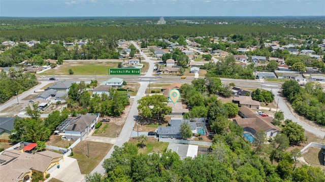 birds eye view of property with a forest view and a residential view