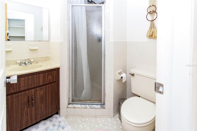 bathroom with toilet, tile walls, and a stall shower