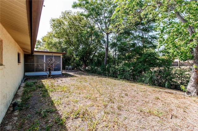 view of yard featuring a sunroom