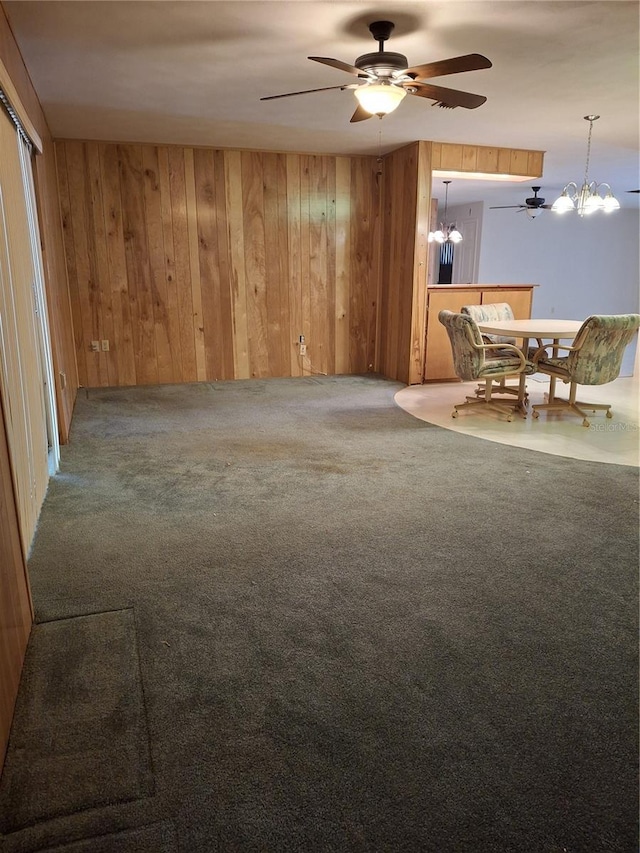 7715 Gulf Highlands Dr, Port Richey, FL 34668 - unfurnished living room with a chandelier, wood walls, a ceiling fan, and carpet