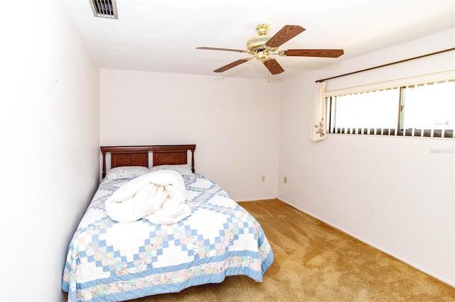 7715 Gulf Highlands Dr, Port Richey, FL 34668 - bedroom featuring carpet and a ceiling fan