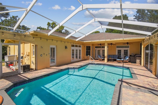 18502 Winding Oaks Blvd, Hudson, FL 34667 - outdoor pool with ceiling fan, a lanai, french doors, a patio, and outdoor lounge area