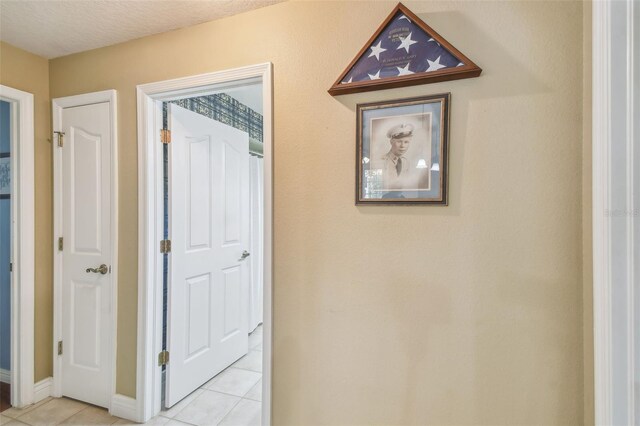 18502 Winding Oaks Blvd, Hudson, FL 34667 - hallway featuring light tile patterned flooring and baseboards