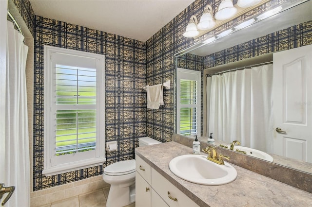 18502 Winding Oaks Blvd, Hudson, FL 34667 - bathroom featuring tile patterned flooring, plenty of natural light, and wallpapered walls