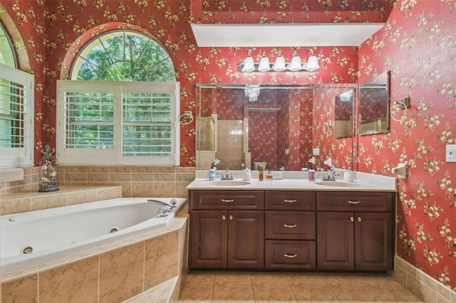 18502 Winding Oaks Blvd, Hudson, FL 34667 - bathroom with tile patterned flooring, a sink, a tub with jets, and tiled shower