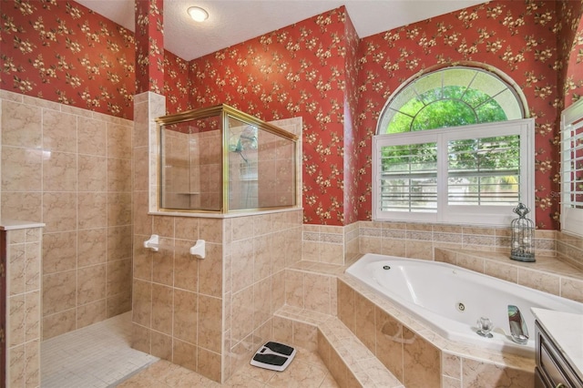 18502 Winding Oaks Blvd, Hudson, FL 34667 - full bath with wallpapered walls, a tub with jets, and tiled shower