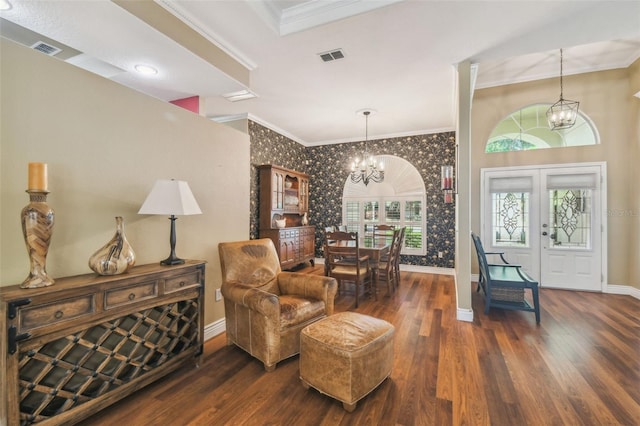 18502 Winding Oaks Blvd, Hudson, FL 34667 - entryway with baseboards, ornamental molding, wallpapered walls, and a notable chandelier