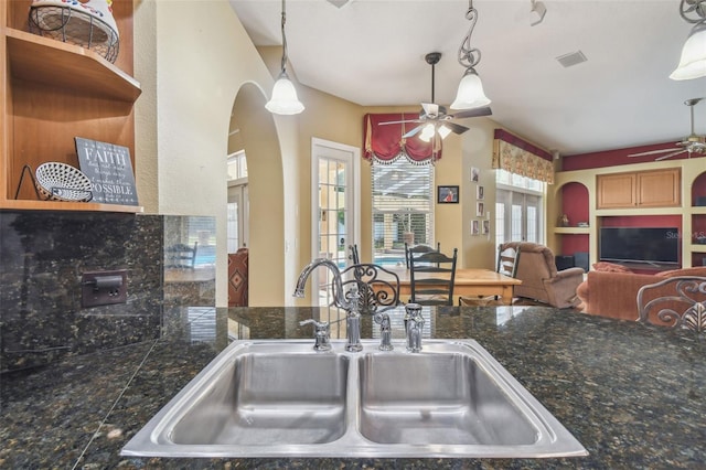 18502 Winding Oaks Blvd, Hudson, FL 34667 - kitchen with a ceiling fan, tile countertops, visible vents, a sink, and open floor plan