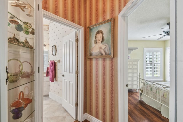 18502 Winding Oaks Blvd, Hudson, FL 34667 - hallway with wallpapered walls and baseboards