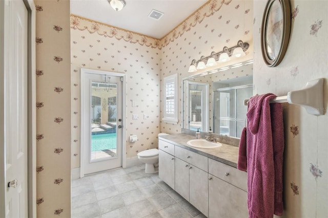 18502 Winding Oaks Blvd, Hudson, FL 34667 - full bath with visible vents, a stall shower, vanity, toilet, and wallpapered walls