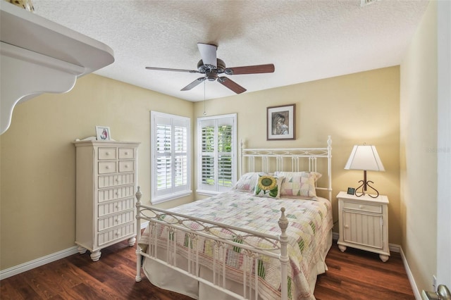 18502 Winding Oaks Blvd, Hudson, FL 34667 - bedroom with a textured ceiling, baseboards, and wood finished floors