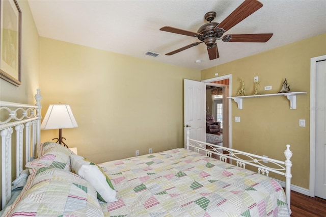 18502 Winding Oaks Blvd, Hudson, FL 34667 - bedroom featuring a ceiling fan, baseboards, visible vents, and wood finished floors