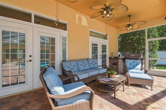 18502 Winding Oaks Blvd, Hudson, FL 34667 - exterior space featuring ceiling fan, french doors, and an outdoor hangout area