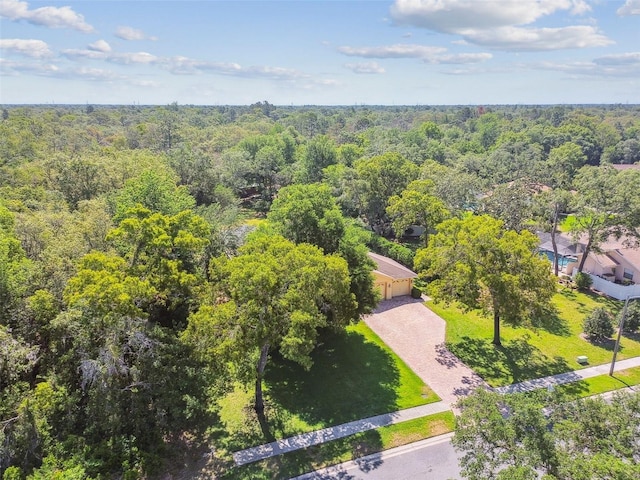 18502 Winding Oaks Blvd, Hudson, FL 34667 - drone / aerial view featuring a view of trees