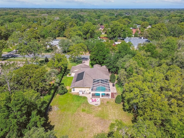 18502 Winding Oaks Blvd, Hudson, FL 34667 - aerial view featuring a wooded view