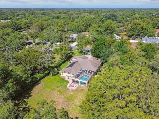 18502 Winding Oaks Blvd, Hudson, FL 34667 - drone / aerial view featuring a forest view
