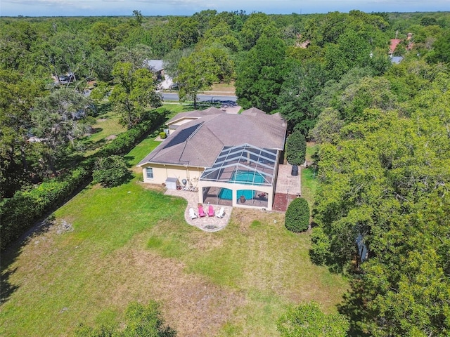 18502 Winding Oaks Blvd, Hudson, FL 34667 - birds eye view of property featuring a wooded view