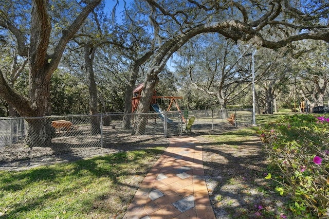 18502 Winding Oaks Blvd, Hudson, FL 34667 - view of yard featuring fence and a playground