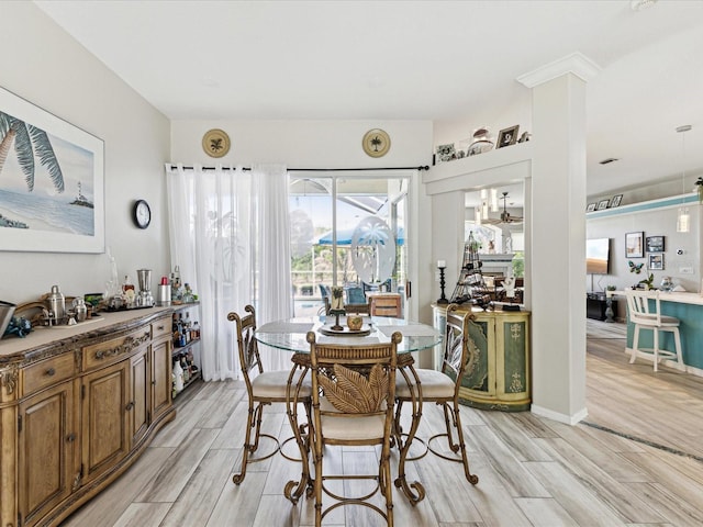 dining area featuring light wood-type flooring