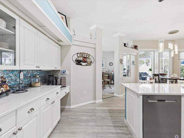 kitchen with decorative backsplash, dishwasher, light countertops, white cabinets, and glass insert cabinets
