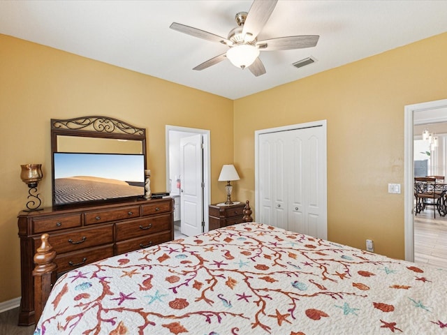 bedroom with a ceiling fan, baseboards, visible vents, and a closet