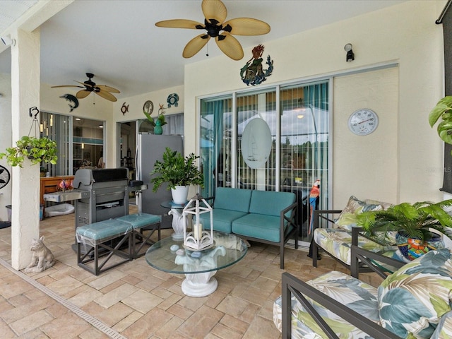 view of patio / terrace featuring an outdoor living space, a ceiling fan, and a grill
