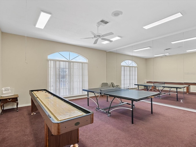 playroom featuring dark carpet and a wealth of natural light