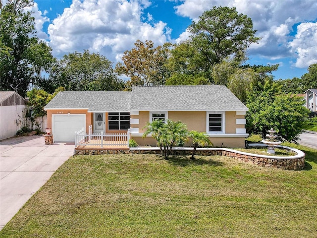 5147 Larch Ln, New Port Richey, FL 34653 - ranch-style house with concrete driveway, an attached garage, a front yard, and stucco siding