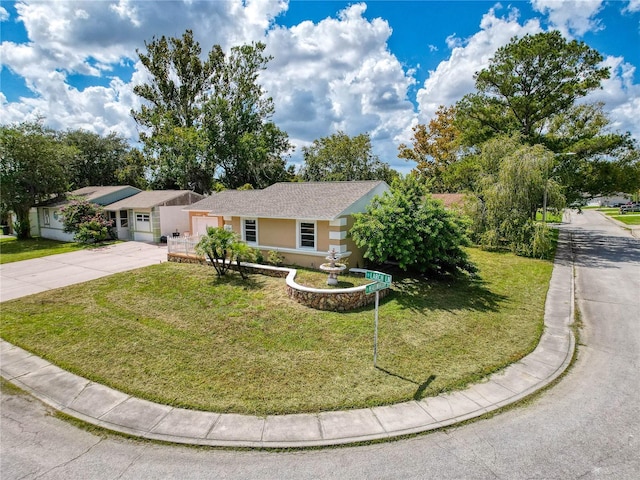 5147 Larch Ln, New Port Richey, FL 34653 - single story home with stucco siding, an attached garage, driveway, and a front lawn