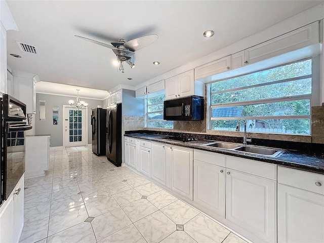 5147 Larch Ln, New Port Richey, FL 34653 - kitchen with a sink, marble finish floor, ceiling fan with notable chandelier, visible vents, and black appliances