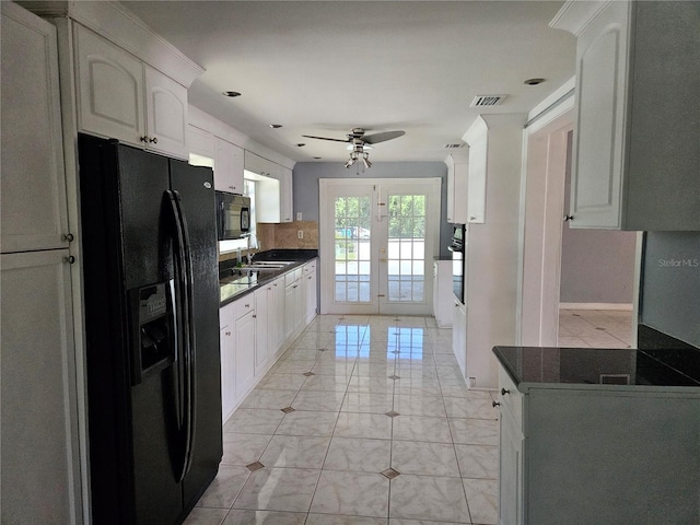 5147 Larch Ln, New Port Richey, FL 34653 - kitchen with visible vents, dark countertops, french doors, a sink, and black appliances