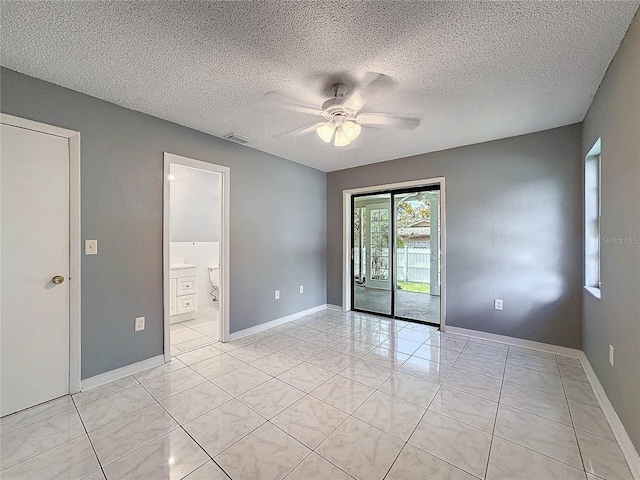 5147 Larch Ln, New Port Richey, FL 34653 - unfurnished room featuring baseboards, a ceiling fan, a textured ceiling, and visible vents