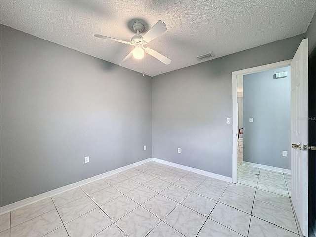 5147 Larch Ln, New Port Richey, FL 34653 - empty room with a textured ceiling, ceiling fan, visible vents, and baseboards