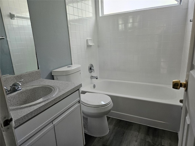 5147 Larch Ln, New Port Richey, FL 34653 - full bath with toilet, plenty of natural light, wood finished floors, and vanity