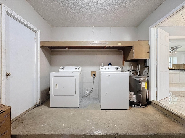 5147 Larch Ln, New Port Richey, FL 34653 - washroom featuring ceiling fan, laundry area, a textured ceiling, washing machine and clothes dryer, and water heater