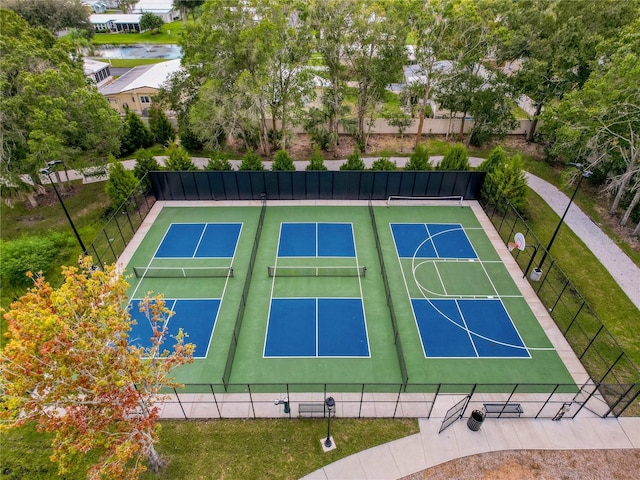 5147 Larch Ln, New Port Richey, FL 34653 - view of basketball court featuring fence, community basketball court, and a tennis court
