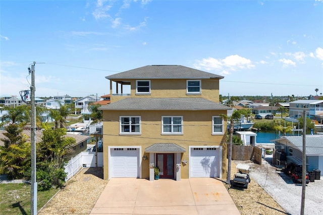 13810 Celida Ave, Hudson, FL 34667 - view of front facade featuring fence, concrete driveway, a residential view, stucco siding, and a garage