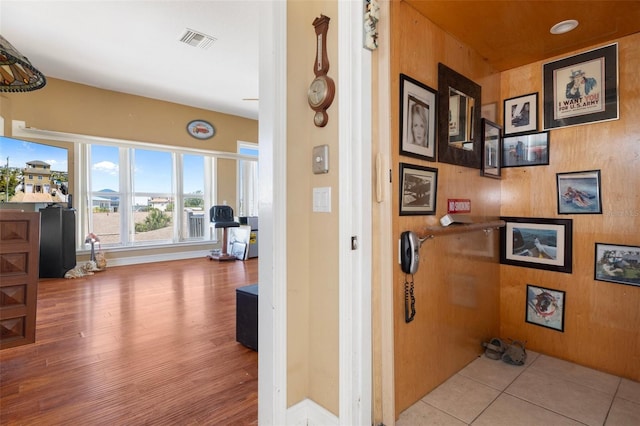13810 Celida Ave, Hudson, FL 34667 - corridor with wooden walls, visible vents, and wood finished floors