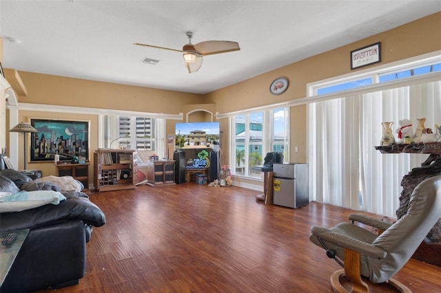 13810 Celida Ave, Hudson, FL 34667 - living room featuring ceiling fan, wood finished floors, and a healthy amount of sunlight