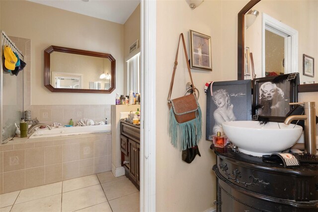 13810 Celida Ave, Hudson, FL 34667 - full bathroom with tile patterned floors, a garden tub, and vanity