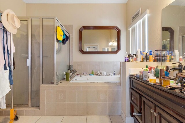 13810 Celida Ave, Hudson, FL 34667 - bathroom with a garden tub, vanity, a shower stall, and tile patterned floors