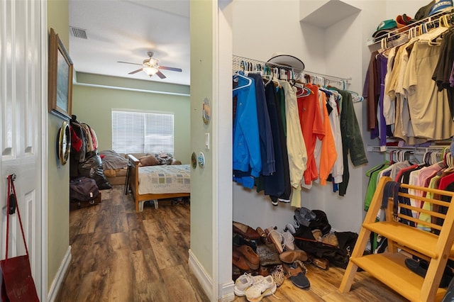 13810 Celida Ave, Hudson, FL 34667 - walk in closet featuring ceiling fan, wood finished floors, and visible vents