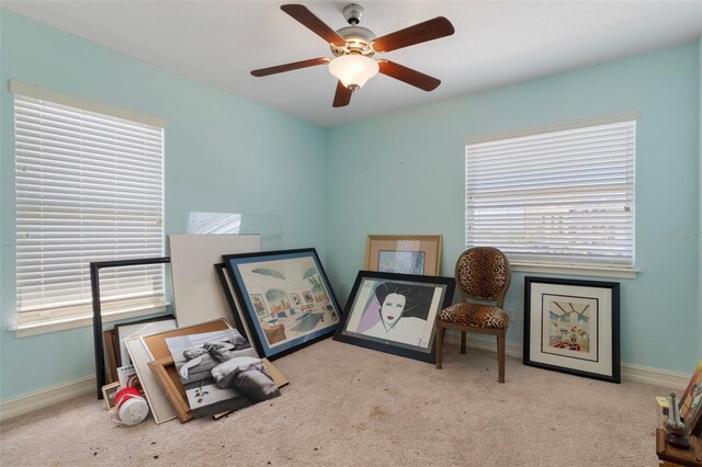 13810 Celida Ave, Hudson, FL 34667 - interior space with a ceiling fan, carpet, and a healthy amount of sunlight