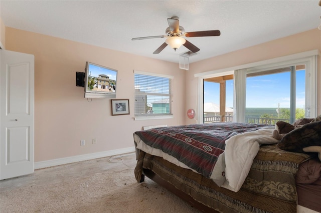 13810 Celida Ave, Hudson, FL 34667 - bedroom with ceiling fan, access to outside, visible vents, carpet, and baseboards